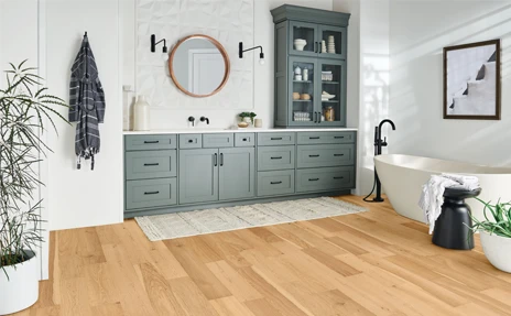 Light hardwood floors in a bathroom