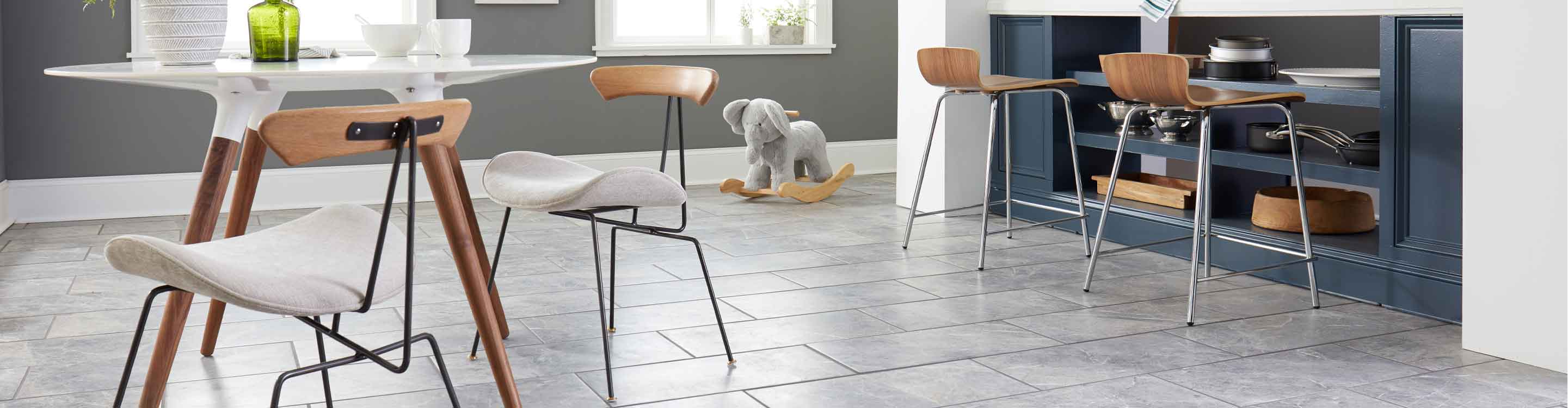 Gray tile flooring in a dining room